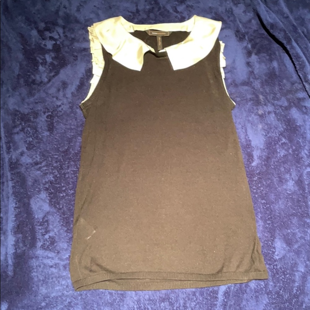 Sleeveless black sweater